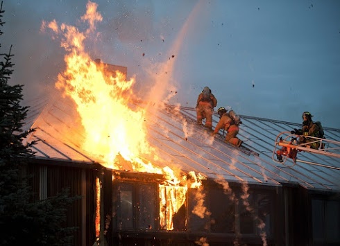 firefighters putting out house fire