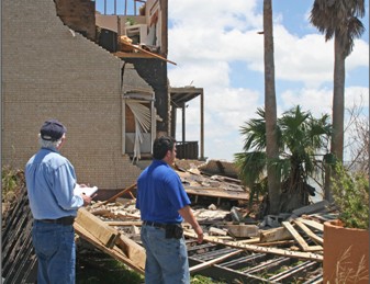 public adjuster at storm damaged building